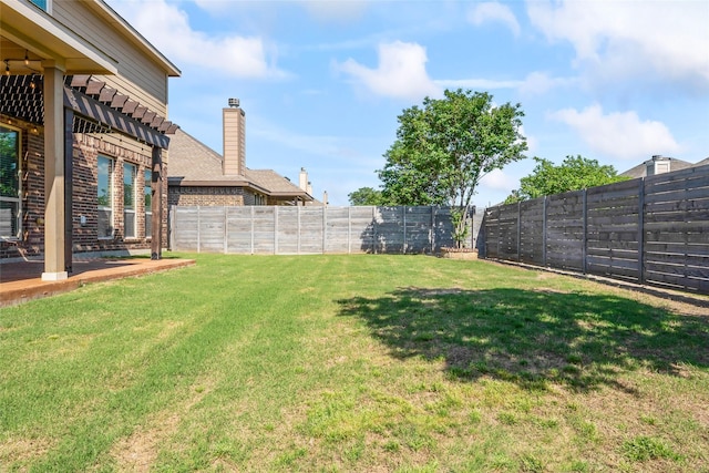 view of yard featuring a fenced backyard