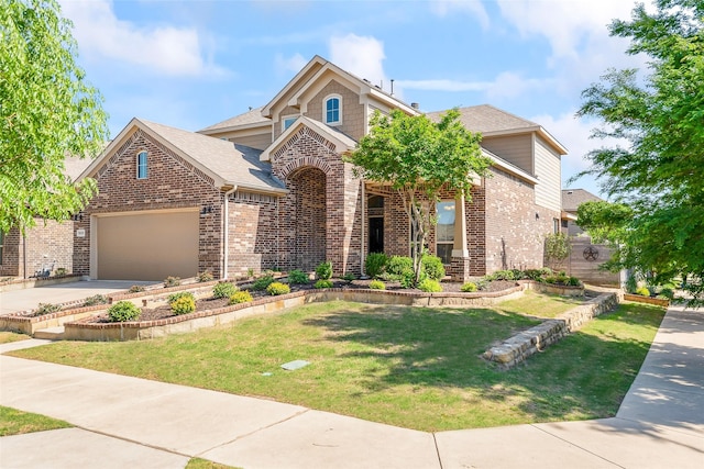view of front of house featuring a front lawn, brick siding, a shingled roof, an attached garage, and driveway