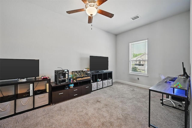 interior space featuring light carpet, baseboards, visible vents, and ceiling fan