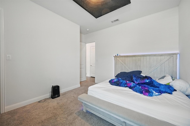 bedroom with baseboards, carpet flooring, and visible vents