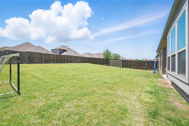 view of yard featuring a fenced backyard