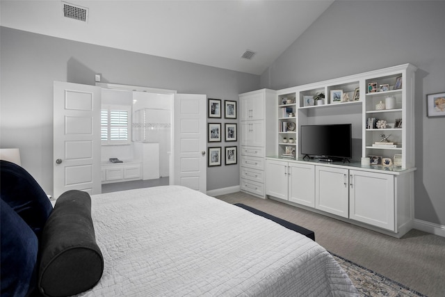 bedroom featuring lofted ceiling, baseboards, and visible vents