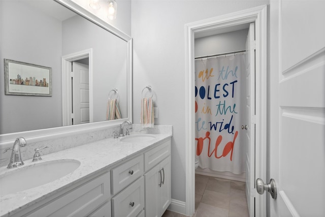 full bath with toilet, a shower with curtain, a sink, and double vanity