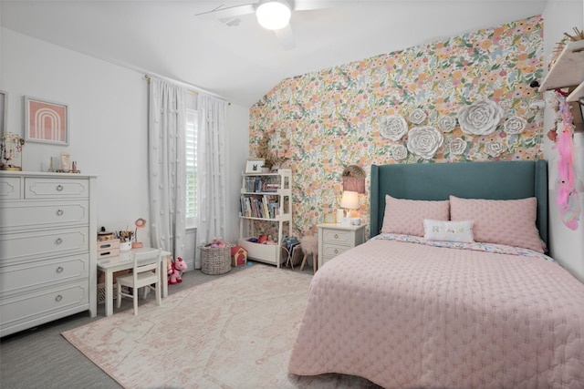 bedroom with vaulted ceiling, a ceiling fan, wallpapered walls, and carpet