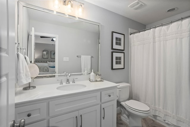 bathroom featuring ensuite bath, toilet, vanity, and visible vents