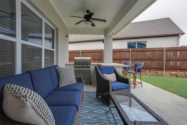 view of patio / terrace featuring fence, an outdoor living space, a ceiling fan, and area for grilling