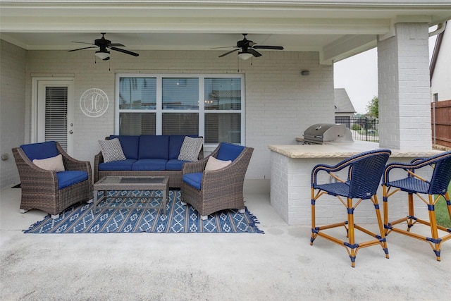 view of patio featuring outdoor lounge area, a ceiling fan, area for grilling, and fence