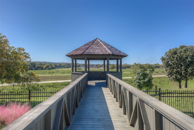 view of property's community with a gazebo and fence