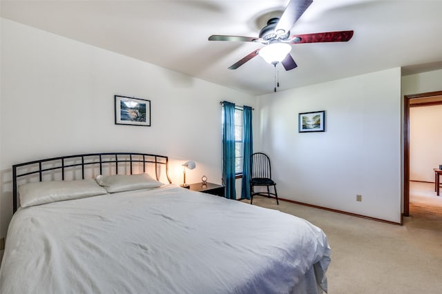 bedroom with carpet, baseboards, and ceiling fan