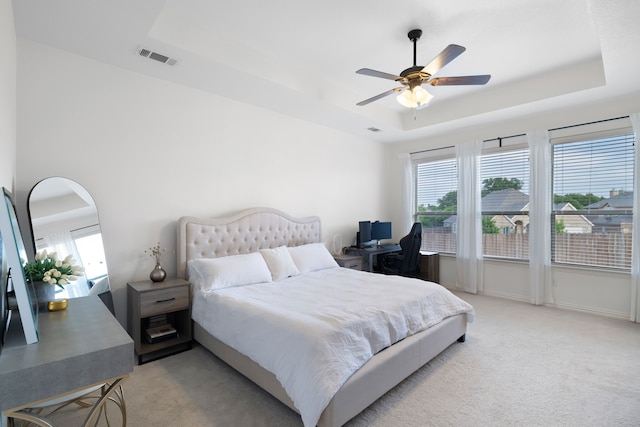 230 Heatherstone Dr, Midlothian, TX 76065 - bedroom with a tray ceiling, light colored carpet, a desk, and ceiling fan
