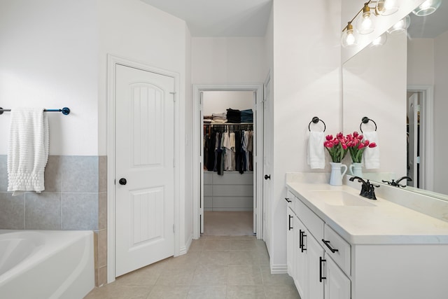 230 Heatherstone Dr, Midlothian, TX 76065 - bathroom with vanity, a bath, tile patterned flooring, and a walk in closet