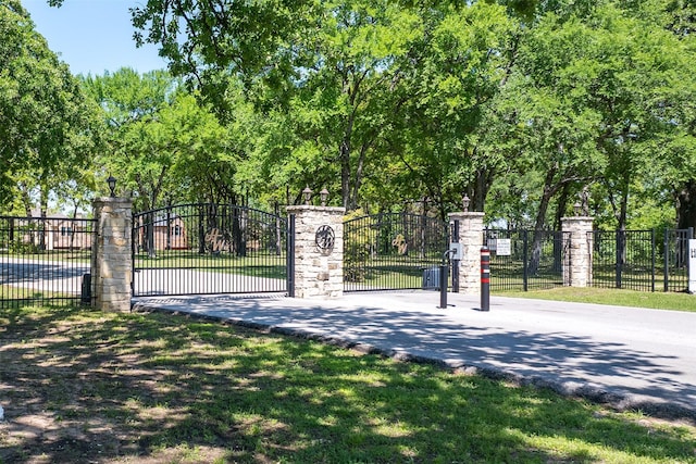 view of gate featuring fence
