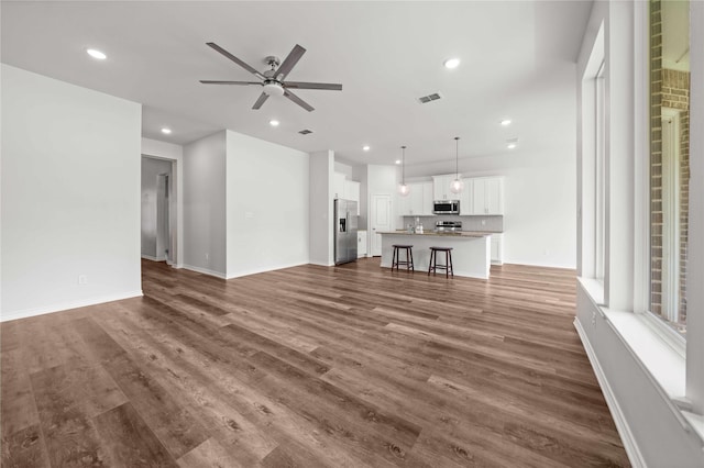 14825 Turtle Creek Ranch Rd, Flint, TX 75762 - unfurnished living room featuring ceiling fan, recessed lighting, dark wood finished floors, and baseboards