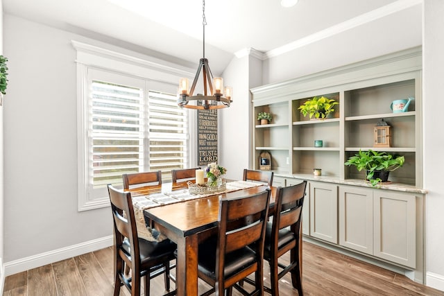 4114 Seminole Trl, Granbury, TX 76048 - dining room with a chandelier, plenty of natural light, crown molding, light wood-type flooring, and baseboards