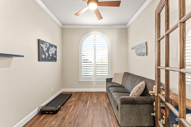 4114 Seminole Trl, Granbury, TX 76048 - living area featuring wood finished floors, ornamental molding, ceiling fan, and baseboards