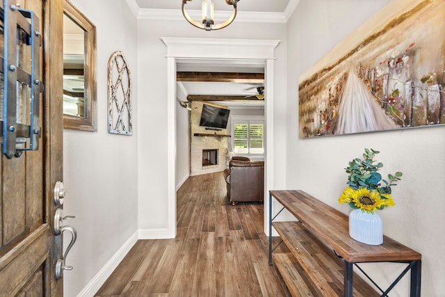 4114 Seminole Trl, Granbury, TX 76048 - entryway featuring wood finished floors, a fireplace, ceiling fan, beamed ceiling, and baseboards