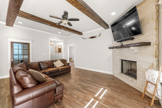 4114 Seminole Trl, Granbury, TX 76048 - living area featuring a ceiling fan, beamed ceiling, a stone fireplace, baseboards, and wood finished floors