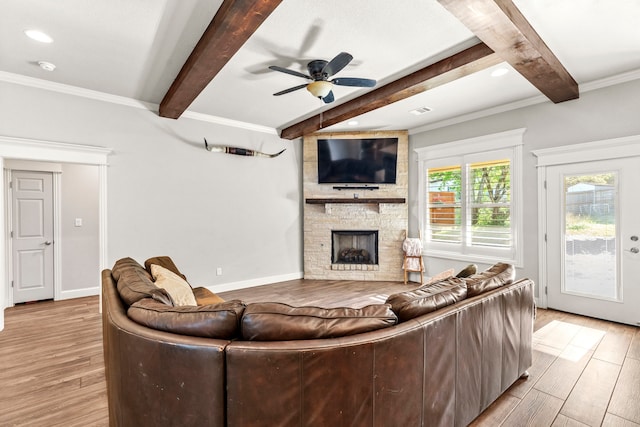 4114 Seminole Trl, Granbury, TX 76048 - living room with wood finished floors, beam ceiling, a fireplace, ceiling fan, and baseboards