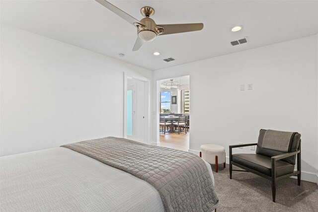 bedroom with recessed lighting, visible vents, and light colored carpet