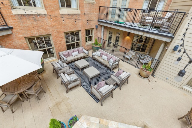 view of patio / terrace with an outdoor hangout area and a balcony
