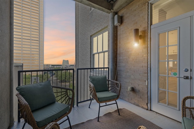 view of balcony at dusk
