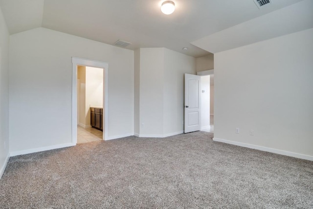 unfurnished bedroom with visible vents, baseboards, and light carpet