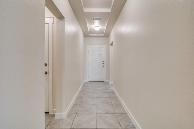 hallway with light tile patterned flooring and visible vents
