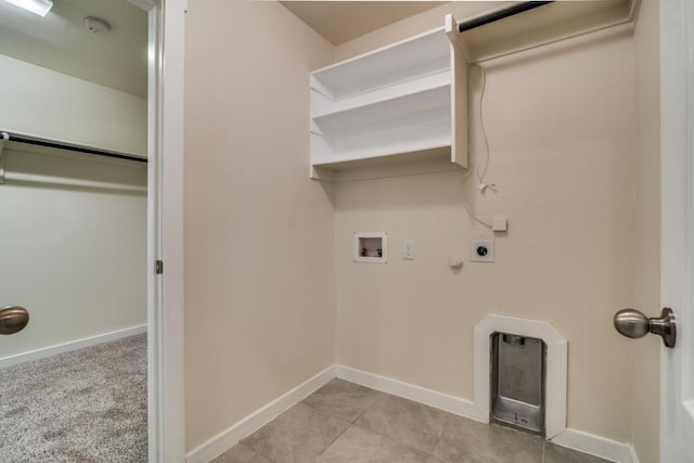 laundry room with washer hookup, hookup for a gas dryer, electric dryer hookup, baseboards, and laundry area