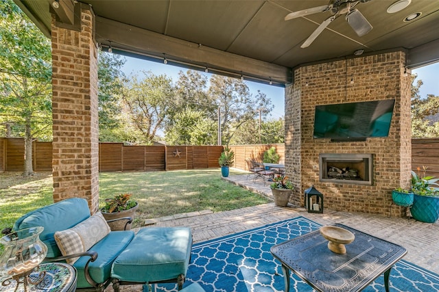 8523 Lakemont Dr, Dallas, TX 75209 - view of patio featuring ceiling fan, a fenced backyard, and an outdoor brick fireplace