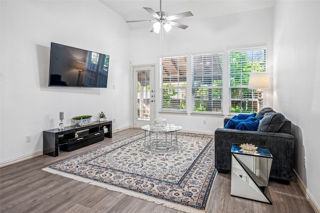 living room with wood finished floors, a healthy amount of sunlight, and a ceiling fan
