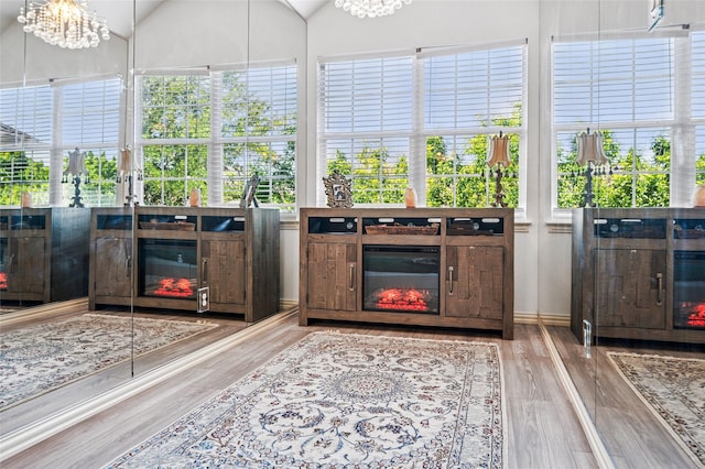 sunroom featuring a chandelier