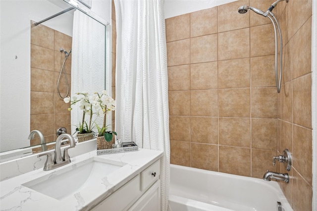 bathroom with shower / bath combo with shower curtain and vanity