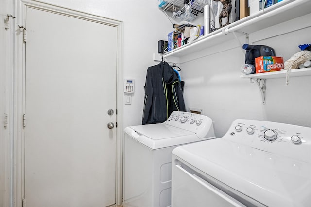 laundry room with washing machine and dryer and laundry area