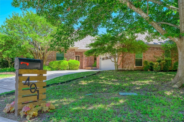 401 Cove Cir, Mckinney, TX 75071 - obstructed view of property featuring brick siding, a front yard, and concrete driveway