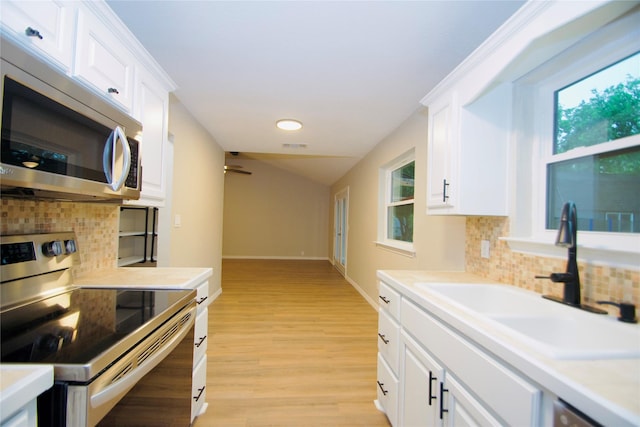 416 Rolling Hills Dr, Aledo, TX 76008 - kitchen with stainless steel appliances, a sink, decorative backsplash, white cabinets, and recessed lighting