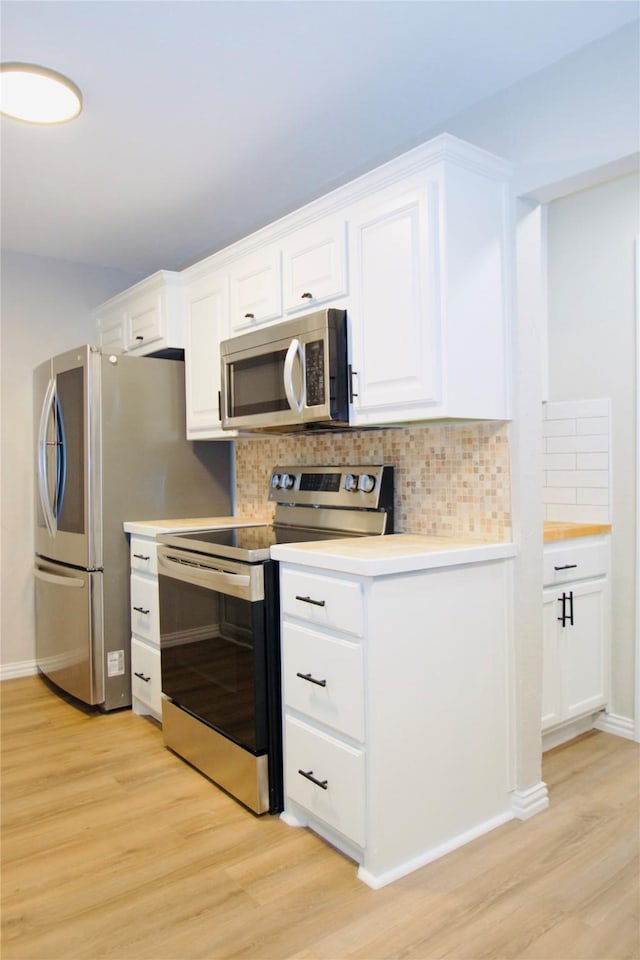 416 Rolling Hills Dr, Aledo, TX 76008 - kitchen featuring stainless steel appliances, light wood-style flooring, tasteful backsplash, white cabinets, and light countertops