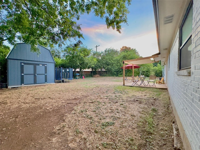 416 Rolling Hills Dr, Aledo, TX 76008 - view of yard with a trampoline and a patio area