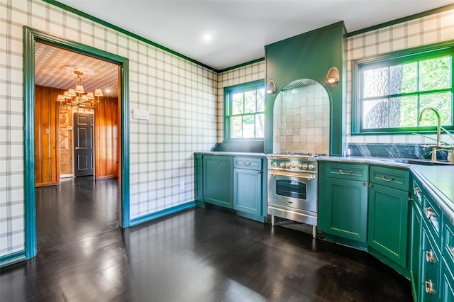 5015 Stoneleigh Ave, Dallas, TX 75235 - kitchen featuring wallpapered walls, high end stainless steel range oven, a sink, and green cabinets