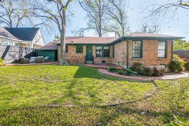 5015 Stoneleigh Ave, Dallas, TX 75235 - rear view of property featuring fence, an outdoor hangout area, a yard, a patio, and brick siding