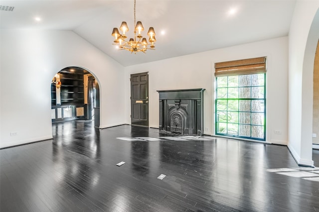 5015 Stoneleigh Ave, Dallas, TX 75235 - unfurnished living room featuring arched walkways, a chandelier, wood finished floors, and lofted ceiling