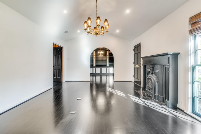 5015 Stoneleigh Ave, Dallas, TX 75235 - unfurnished living room with lofted ceiling, arched walkways, a notable chandelier, and dark wood finished floors