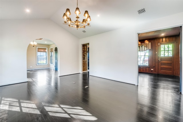 5015 Stoneleigh Ave, Dallas, TX 75235 - spare room with arched walkways, a notable chandelier, and wood finished floors