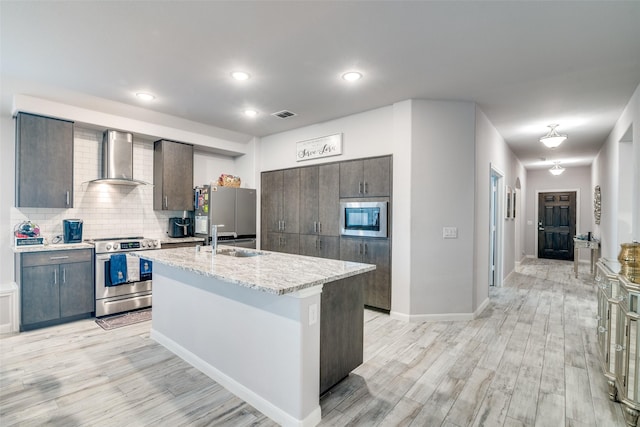 527 Whitney Ln, Lavon, TX 75166 - kitchen featuring dark brown cabinets, wall chimney range hood, light wood finished floors, and stainless steel appliances