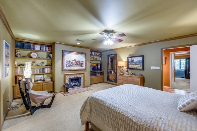 5713 Pershing Ave, Fort Worth, TX 76107 - bedroom with a tile fireplace, visible vents, crown molding, baseboards, and light colored carpet