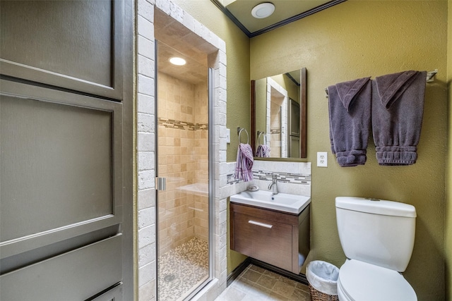 5713 Pershing Ave, Fort Worth, TX 76107 - bathroom with a textured wall, vanity, toilet, and a stall shower