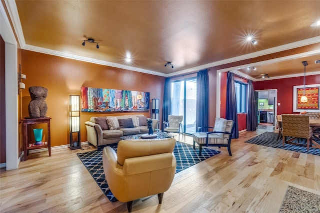 5713 Pershing Ave, Fort Worth, TX 76107 - living area with light wood finished floors, crown molding, and baseboards