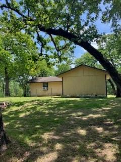 view of property exterior featuring a yard