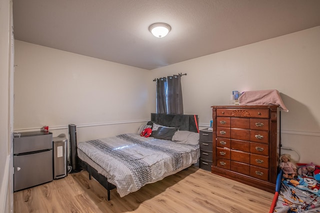 bedroom with light wood-type flooring