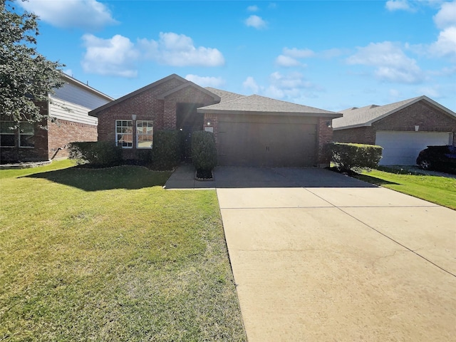 ranch-style house with concrete driveway, brick siding, a garage, and a front yard