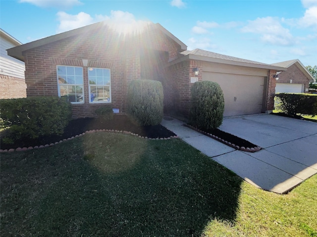 view of side of property featuring a garage, brick siding, and concrete driveway
